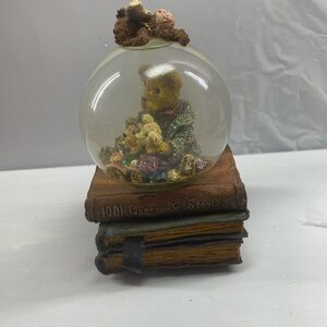 The Boyd’s Bear Music Box snow globe plays what the world needs now is love